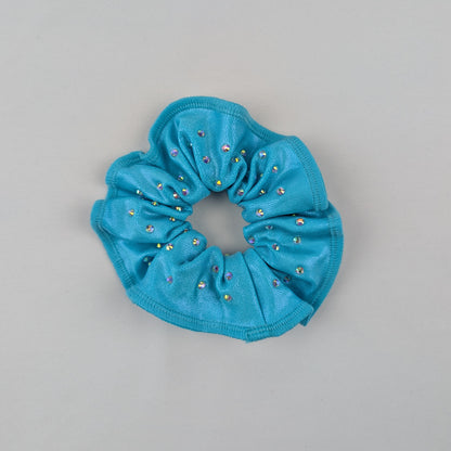 Justaucorps gym "TURQUOISE" — L’intensité du regard, la puissance du mouvement, noir et bleu turquoise, manches longues, dos croisé, ultra strassé, entraînement et compétition
